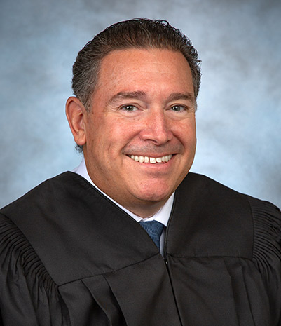 https://sntsymposium.com/wp-content/uploads/2026/07/judge-lund.jpg